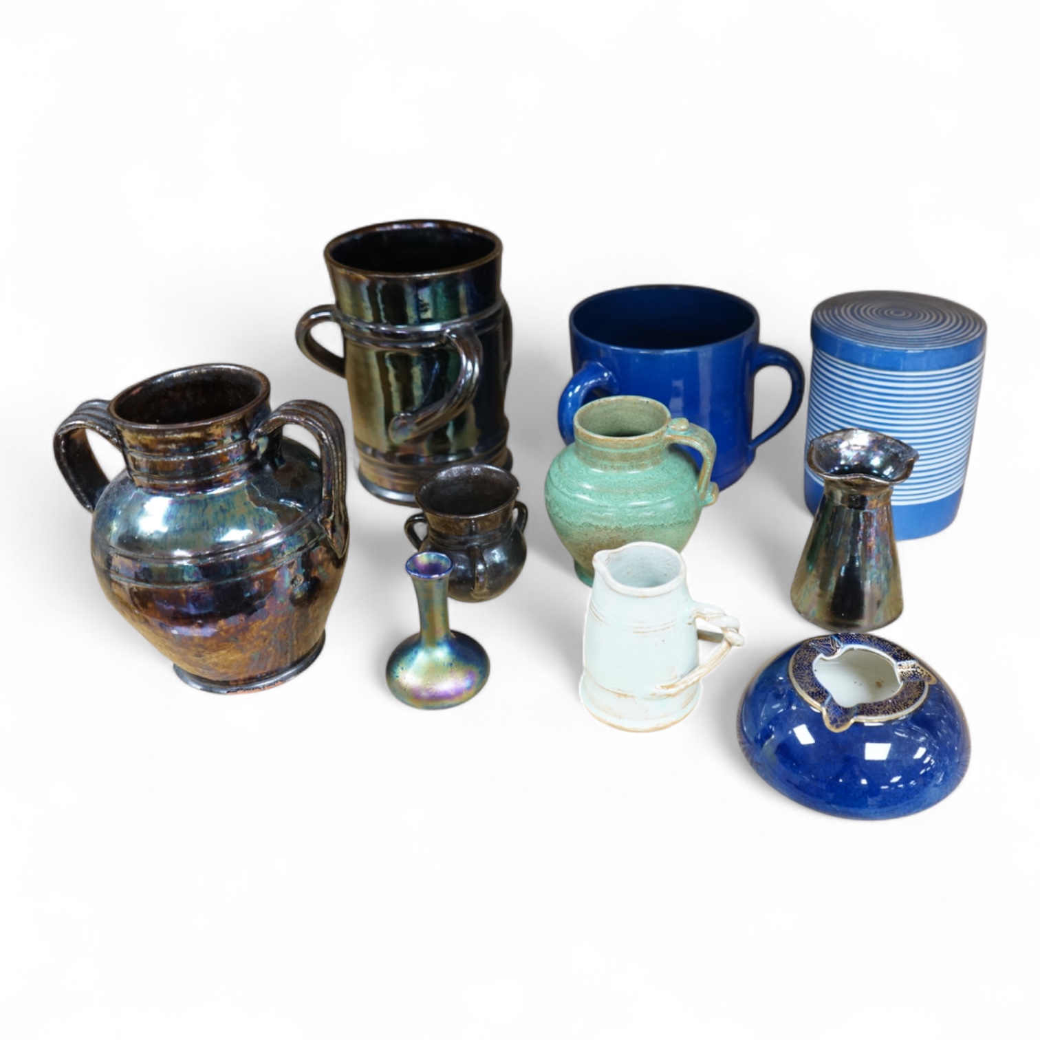 A collection of pottery to include lustre glazed jugs and tygs, a T. G. Green storage jar, Carltonware ash tray and a miniature Ruskin style vase, largest 18cm high